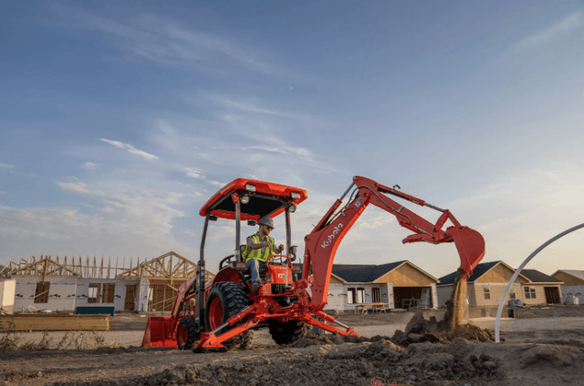 A Tractor Loader Backhoe excavating on a site