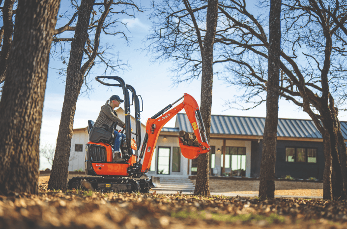 Woman excavating in a wooded area