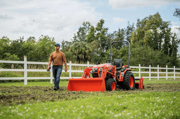 Man walking alongside his tractor