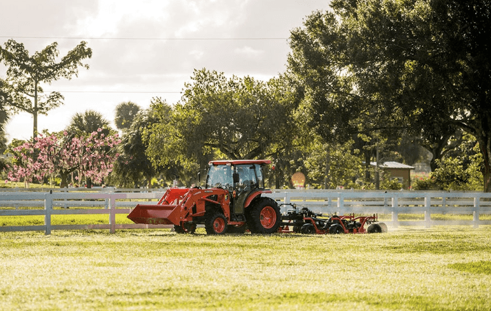 Tractor in field with rear implement