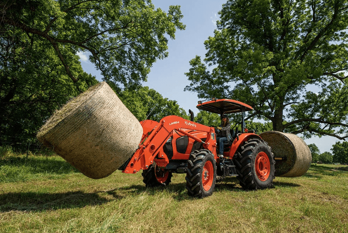 M5 Series tractor moving hay bales with front and rear implements