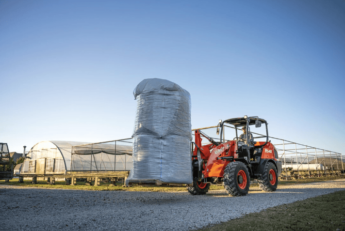 Wheel loader moving material