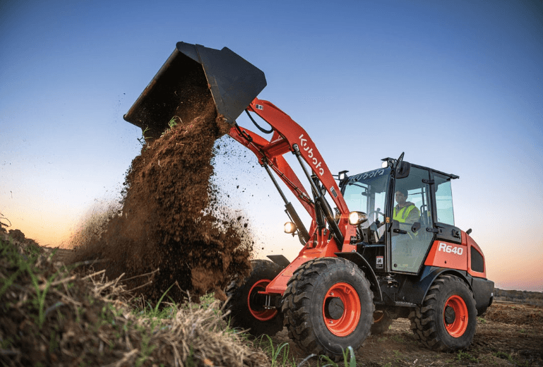 Wheel loader dumping dirt