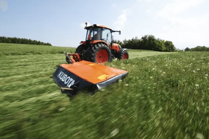 Tractor mowing with disc mower