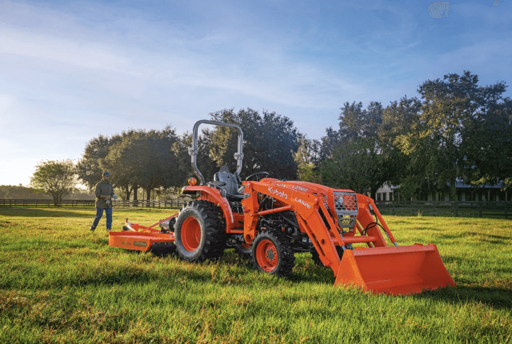 Man walking behind tractor