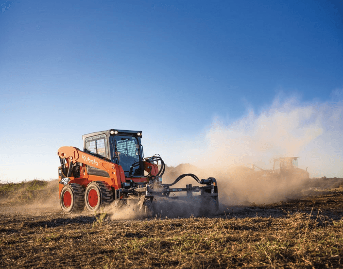 Skid Steer with leveling attachment