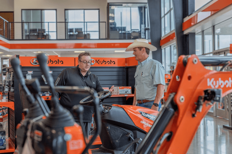 Kubota Staff showing model in show room